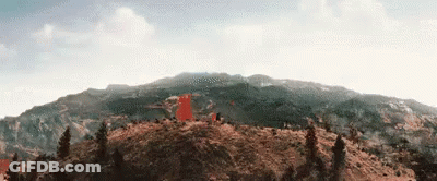 Mountain With Trees And Red Flag GIF