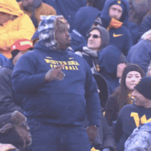 Mountaineers Fan Wearing Hood Cheering And Dancing GIF