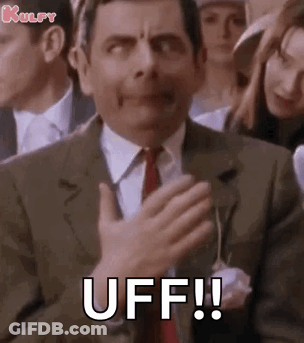 Mr Bean Applauding With Funny Face In Suit And Tie GIF