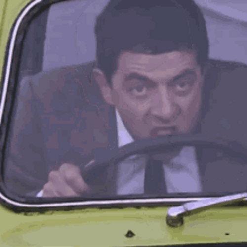 Mr. Bean Driving With His Teeth GIF