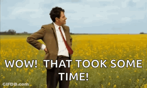 Mr Bean Is Standing In A Field Of Yellow Flowers . GIF