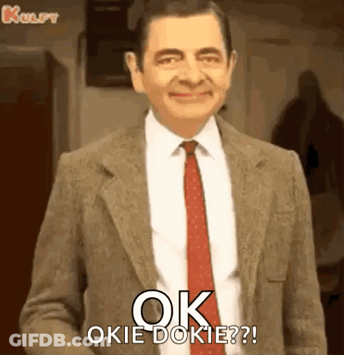 Mr Bean Is Wearing A Suit And Tie And Says `` Ok Okie Dokie ? '' GIF