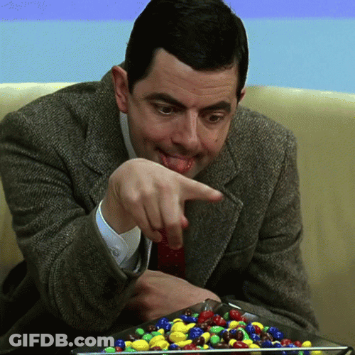 Mr. Bean Picking Candy GIF