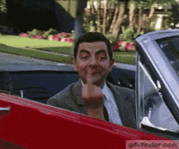 Mr. Bean Riding Car Flipping Off Funny GIF