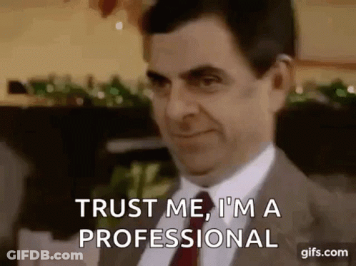Mr Bean Saying Trust Me I'm A Professional In Suit And Tie GIF