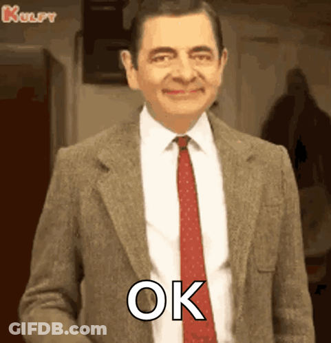 Mr Bean Smiling And Saying Ok GIF