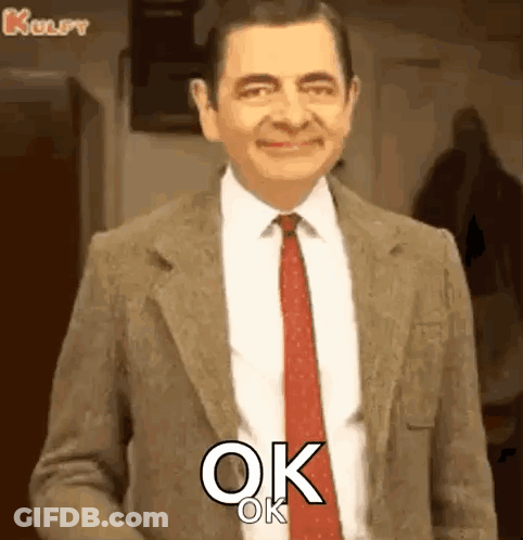 Mr Bean Smiling And Saying Ok GIF