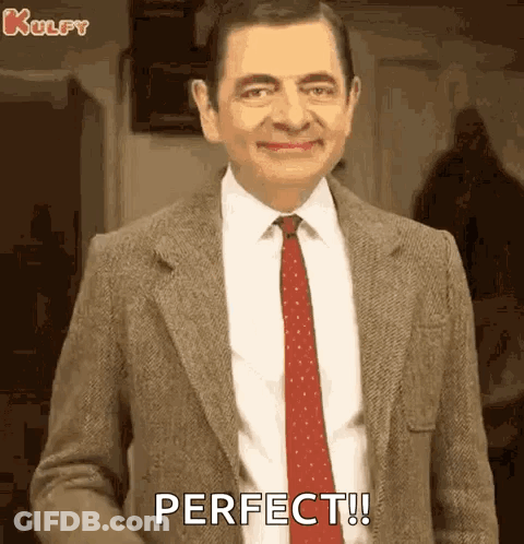 Mr Bean Smiling And Saying Perfect GIF
