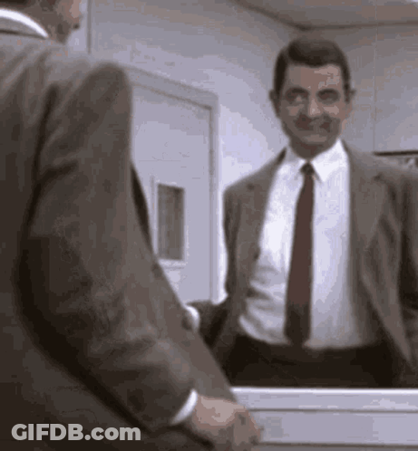 Mr Bean Smiling In Front Of Mirror GIF