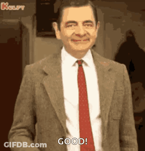 Mr Bean Smiling In Suit And Tie GIF