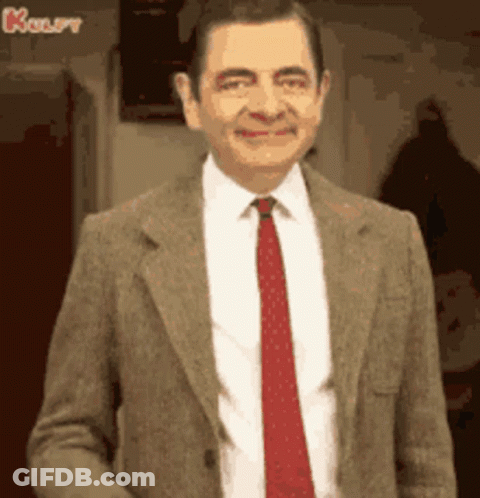 Mr Bean Smiling In Suit And Tie GIF