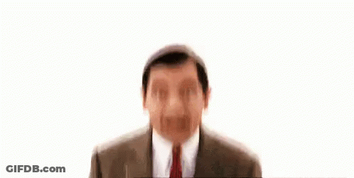 Mr Bean Smiling In Suit And Tie GIF