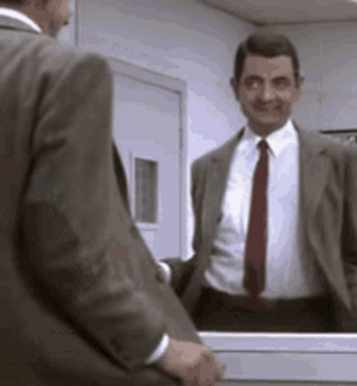 Mr. Bean Watching Himself Doing The Funny Dancing GIF
