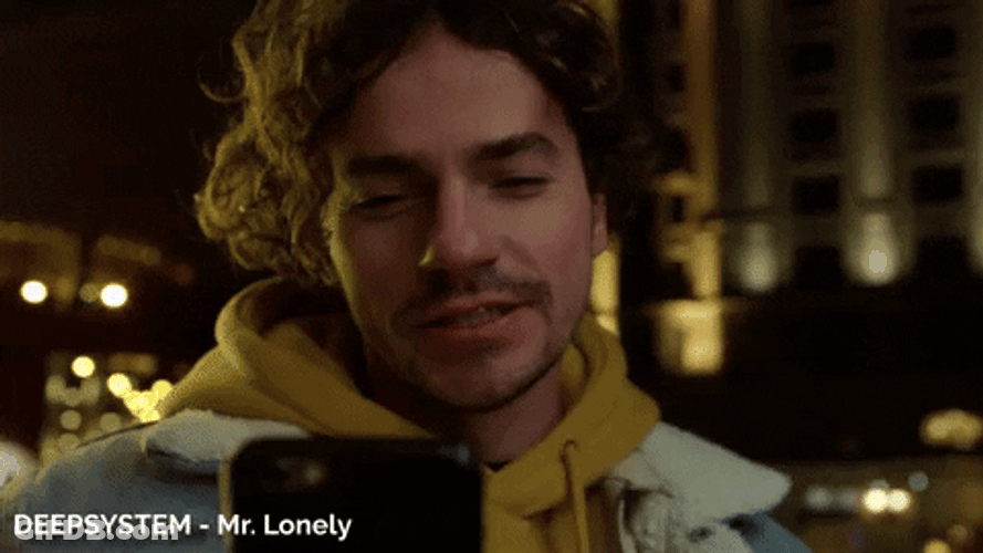 Mr Lonely Sending Kisses In Phone GIF
