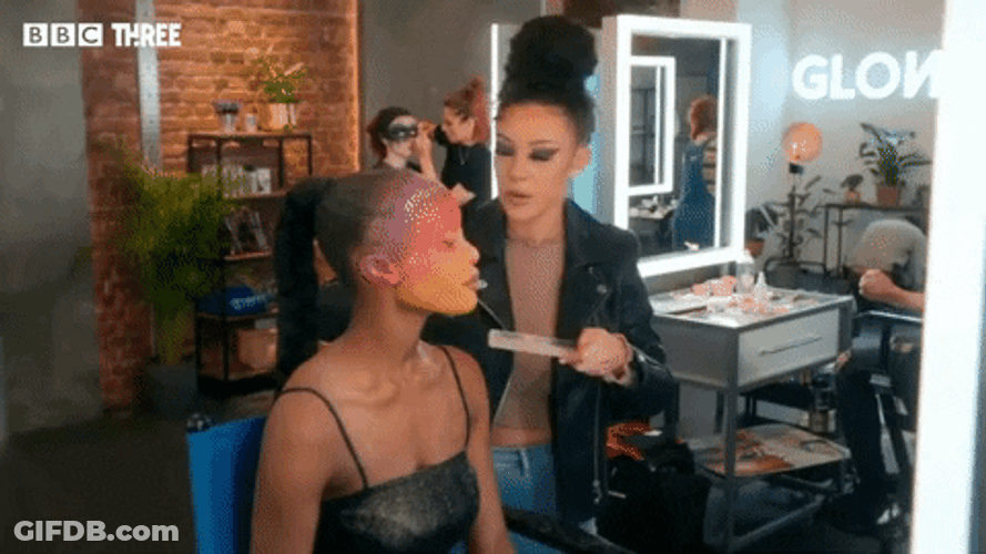 Mua Puts Face Paint Walking On Model GIF