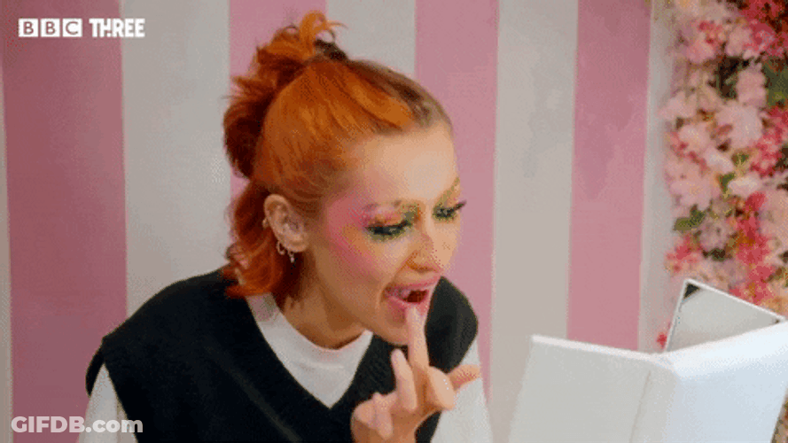 Mua Puts Lipstick Using Hands GIF