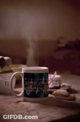 Mug With Music Notes Next To Cookies GIF