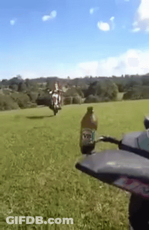 Mullet Haired Guy Doing Motorcycle Tricks GIF