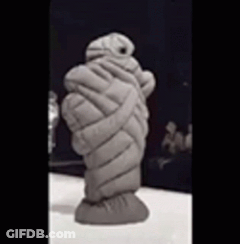 Mummy Statue Wrapped In Blanket Sitting On Table GIF