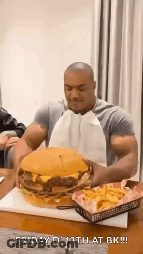 Muscular Man Eating Giant Hamburger And French Fries GIF