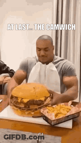 Muscular Man Eating Giant Hamburger And French Fries GIF