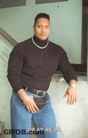 Muscular Man In Black Turtleneck And Blue Jeans GIF