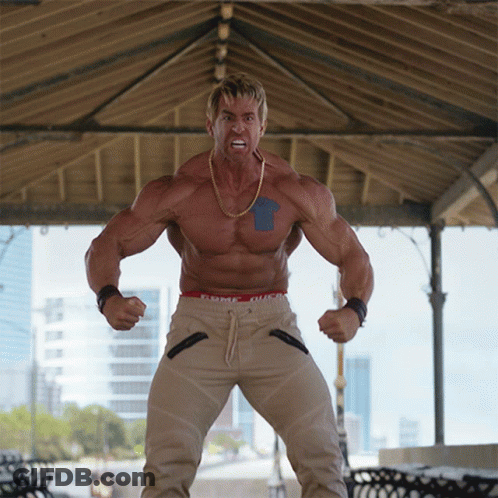 Muscular Man With Blue Arrow In Front Of Gazebo GIF