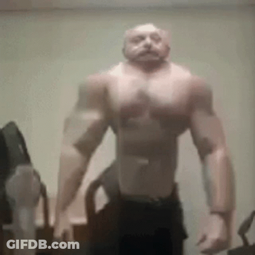 Muscular Man Without Shirt Standing In Room GIF