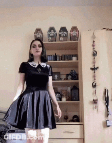 Musician Dani Bentham Trying On Mini Skirt GIF