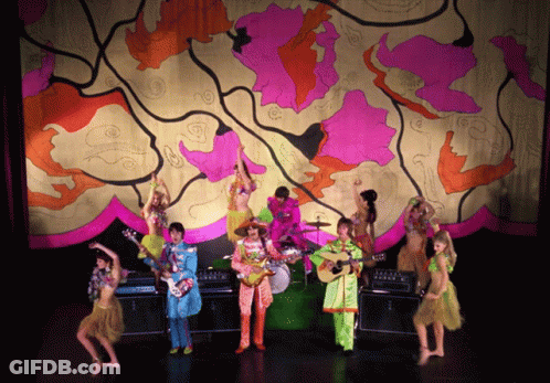 Musicians Playing On Colorful Stage GIF