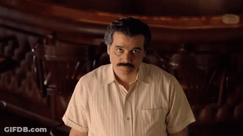 Mustached Man At Wooden Table GIF