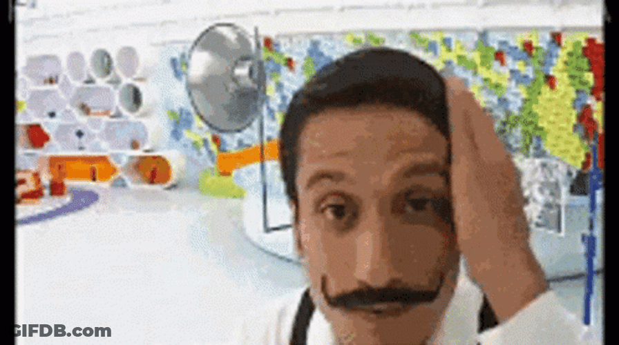 Mustached Man Grooming In Mirror GIF