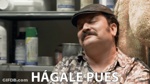 Mustached Man In Front Of Hagale Pues Shelf GIF