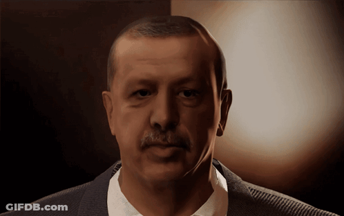 Mustached Man In Suit Looking At Camera GIF