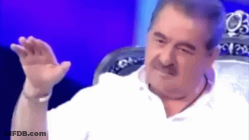 Mustached Man Sitting In Chair Hand Outstretched GIF