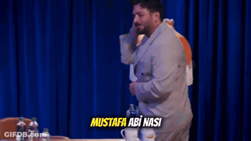 Mustafa Abi Nasi Man Behind Table GIF