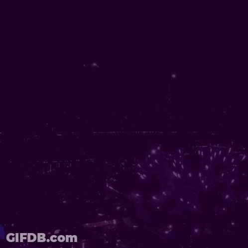 Muzikal On Purple Background With Fireworks GIF