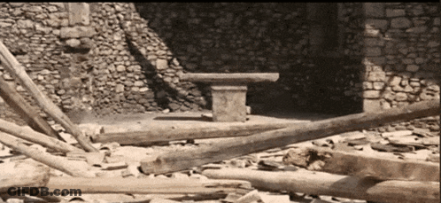 Mystery Shack Lit Up In Rain At Night GIF