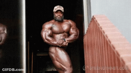 Naked Bodybuilder By Brick Wall GIF