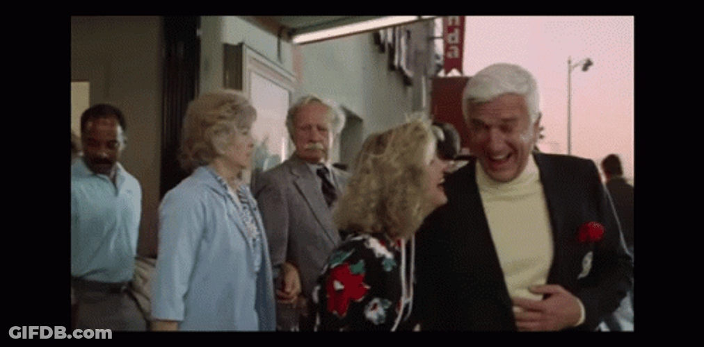 Naked Gun Frank Drebin And Jane Spencer Laughing GIF