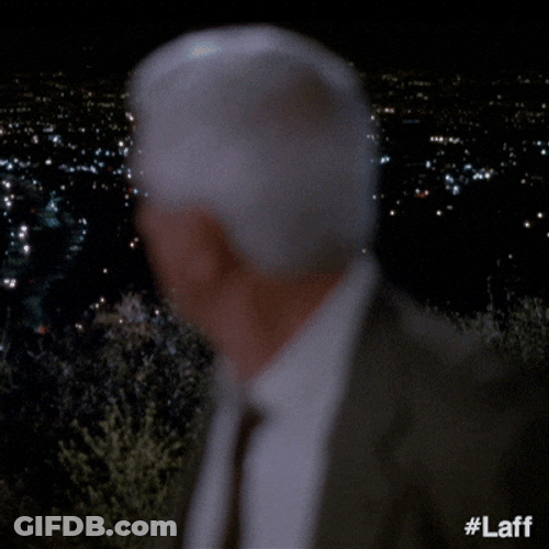 Naked Gun Frank Drebin Looking Surprised GIF