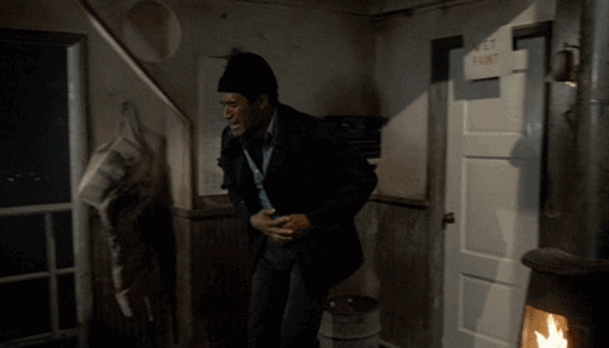 Naked Gun Officer Nordberg Burning His Hand GIF