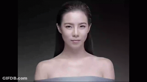 Naked Woman In Blue Cloth Looking At Camera GIF