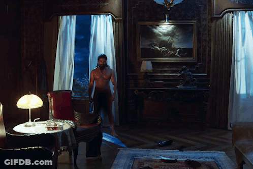 Naked Woman Standing In Room With Lamp GIF