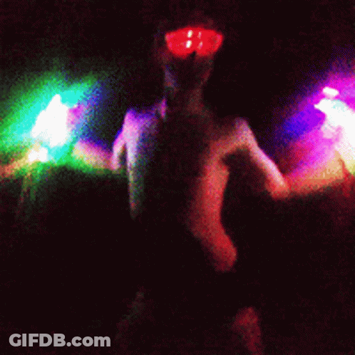 Naked Woman Wearing Glow Goggles GIF