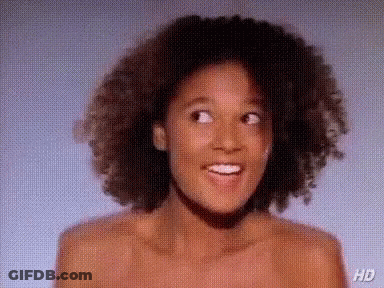 Naked Woman With Curly Hair Smiling GIF