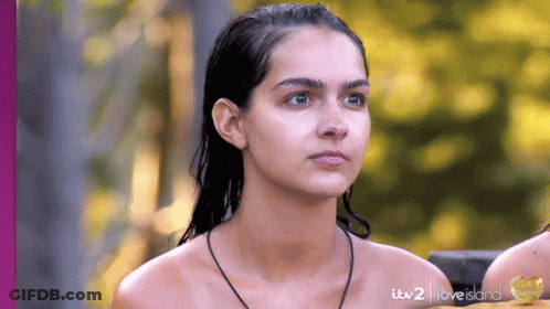 Naked Woman With Necklace Looking At Camera GIF