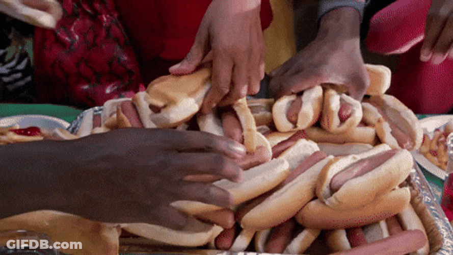 National Hot Dog Day Lady Getting Sandwich GIF