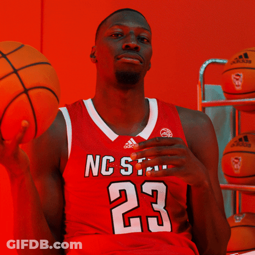 Nc State Guy Sitting Playing With Ball GIF