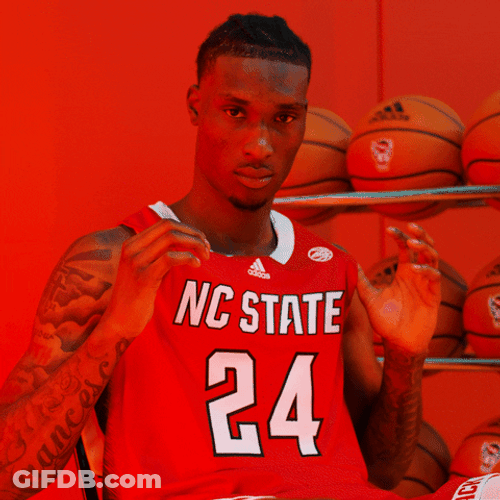 Nc State Wolfpack Holding Jersey Proudly GIF